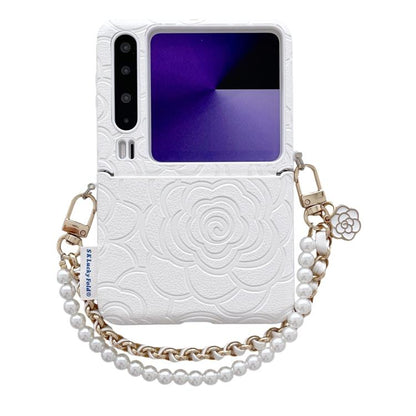 White embossed camellia phone case with side buckle and pearl chain shoulder strap