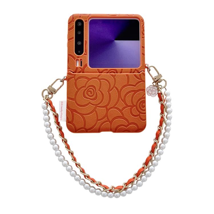 Orange embossed camellia phone case with side buckle and pearl-bead bracelet chain