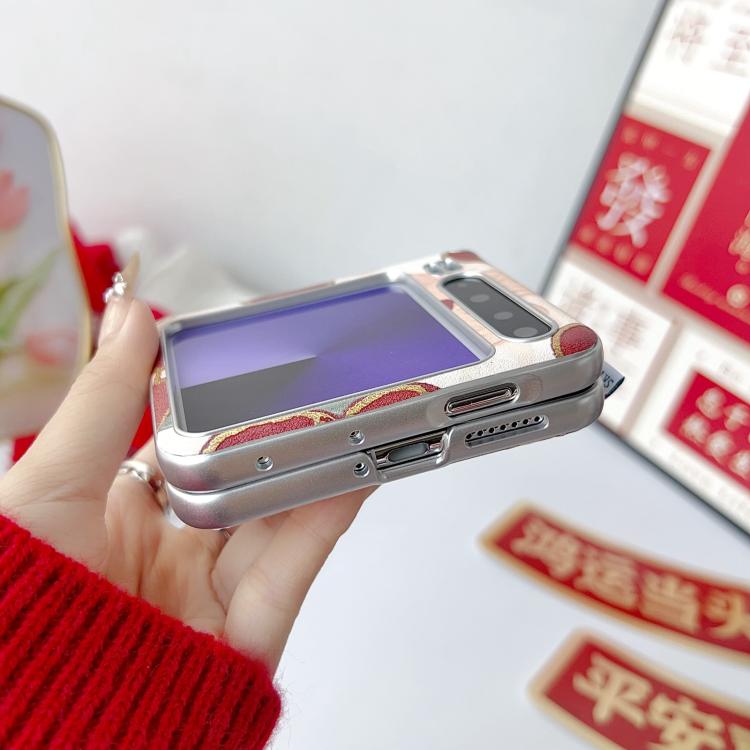 Silver-tone phone case with lucky dog print back and wrist strap connector