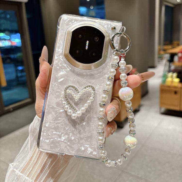 Clear white phone case with heart charm and pearl beaded love bracelet, held up