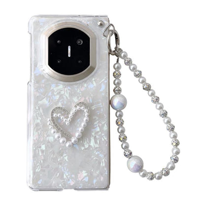 Light pink shell-pattern phone case with heart beaded design and pearl bracelet strap