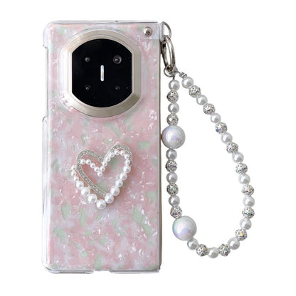Pink shell-pattern phone case with heart rhinestone-and-pearl design and beaded strap