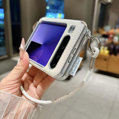 Light gray textured phone case with silver edge, side buckle, and star charm strap