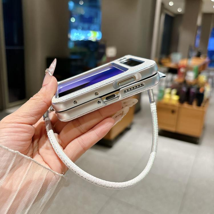 Side view of light gray textured phone case with silver edge and wrist strap