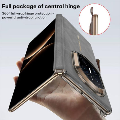 Folding phone case with central hinge and metal frame, showing camera cover