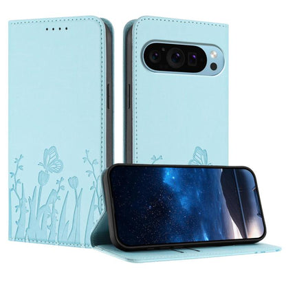 Light blue magnetic flip phone wallet case with tulip and butterfly pattern and camera cutout