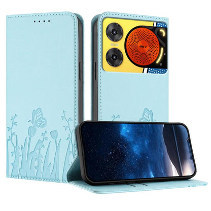 Light blue folio phone case in vegan leather with butterfly and tulip pattern, magnetic closure.