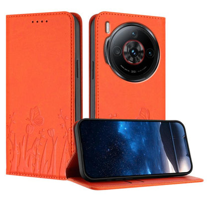 Orange magnetic vegan leather phone case with tulip and butterfly pattern, folio stand