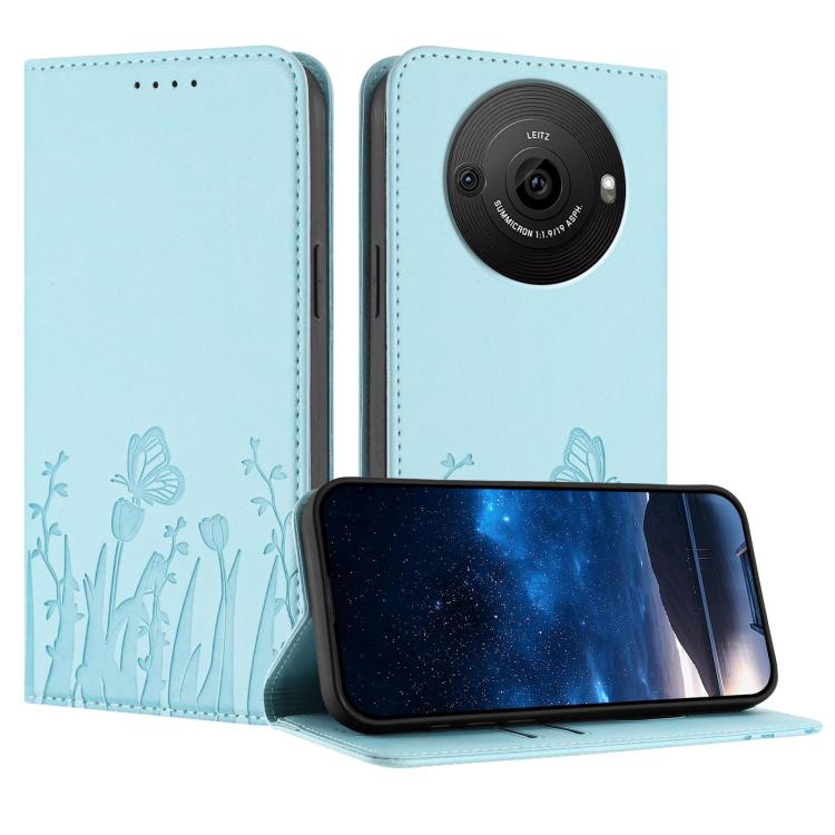 Light blue magnetic vegan leather phone case with tulip and butterfly line art, front flap open