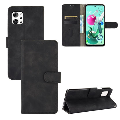Black PU leather flip phone case with magnetic buckle and card slots, wallet-style folio.