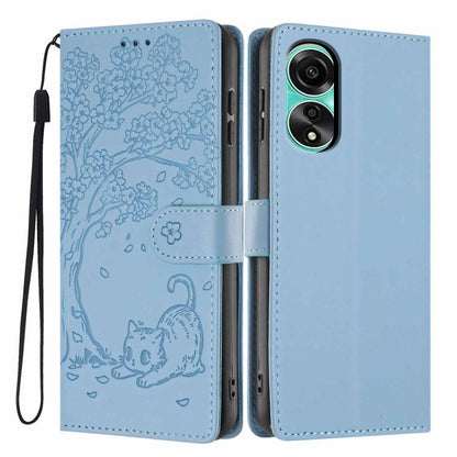 Light blue flip phone case with embossed tree-cat pattern, vegan leather, wrist strap