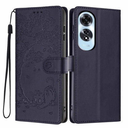 Dark navy flip phone case with embossed cat design, wrist strap, and dual camera opening