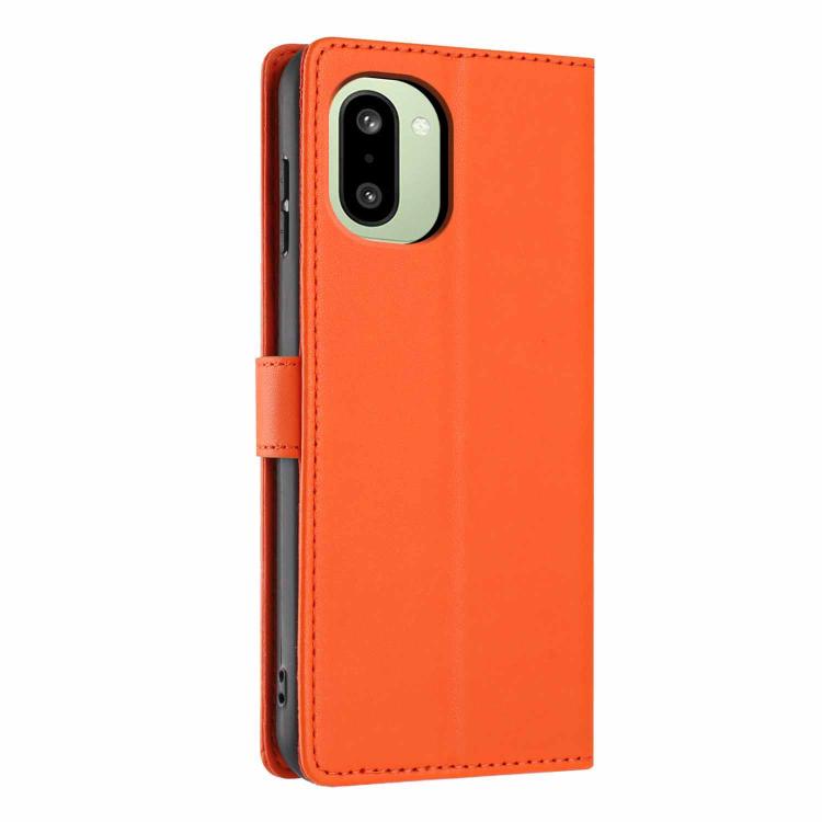 Orange flip phone case with cat-tree embossed design, camera cutout, and smooth flip cover
