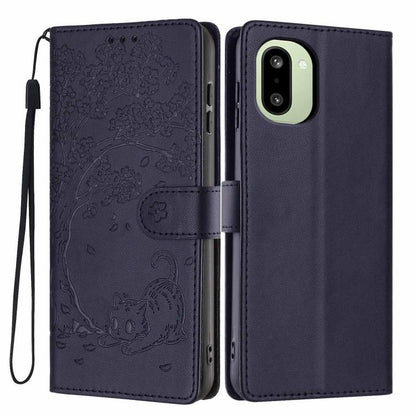 Dark blue flip vegan leather phone case with embossed tree and cat, wrist strap