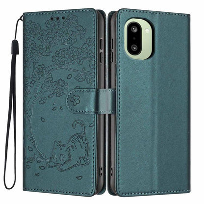 Deep green flip vegan leather phone case with embossed tree and cat, wrist strap
