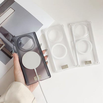 Phone cases on display: dark magnetic hinge case and clear magnetic hinge case
