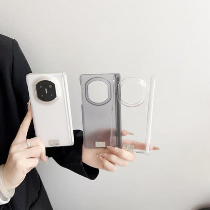 Set of clear and white magnetic phone cases with camera cutouts and nameplates
