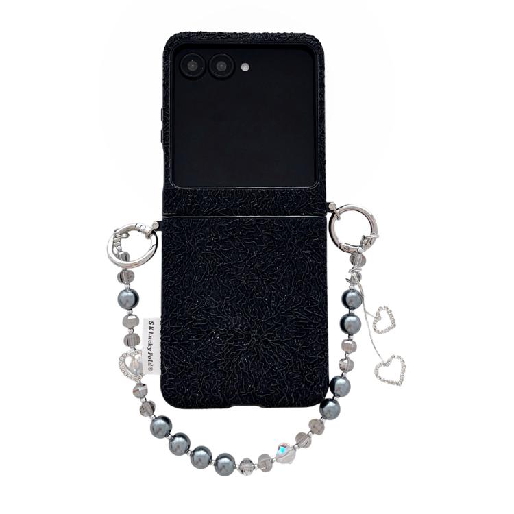 Black lace-embossed phone case with dual metal hooks and beaded wrist strap