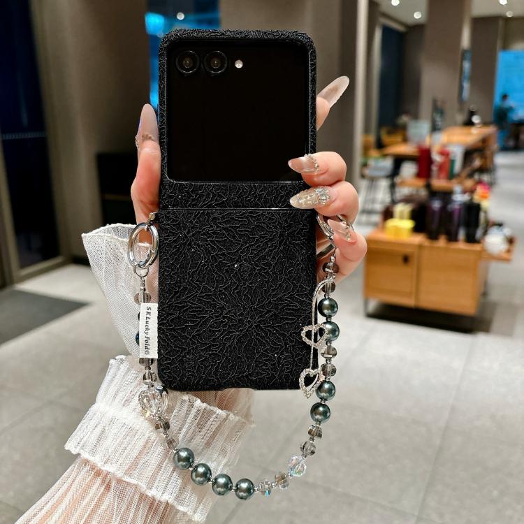 Black lace-embossed phone case with dual metal hooks and beaded wrist strap