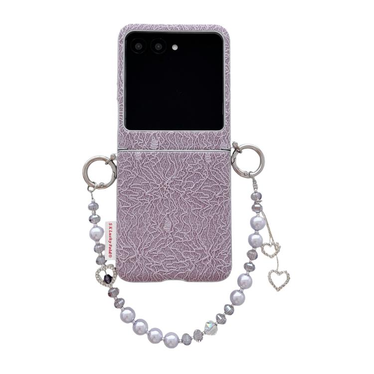 Purple lace-embossed phone case with dual metal hooks and beaded wrist strap