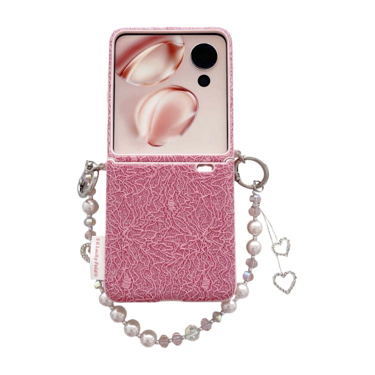 Pink lace-embossed phone case with dual metal hooks and pearl wrist strap with heart charms