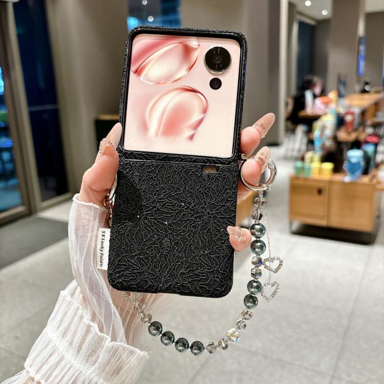 Black lace-embossed phone case with metal hooks and beaded wrist strap, heart charms