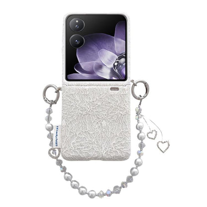 White lace-embossed phone case with metal hooks and pearl wrist strap