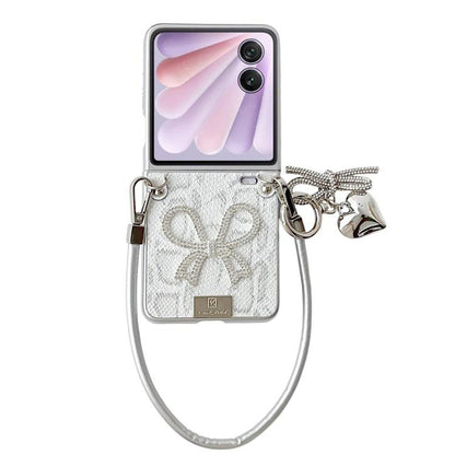 Silver scale-texture bow phone case with wrist strap, charms, and nameplate