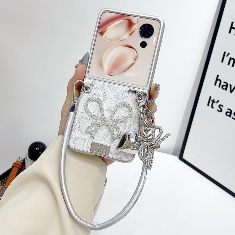 Silver scale-texture bow phone case with wrist strap and dangling heart/chain charm