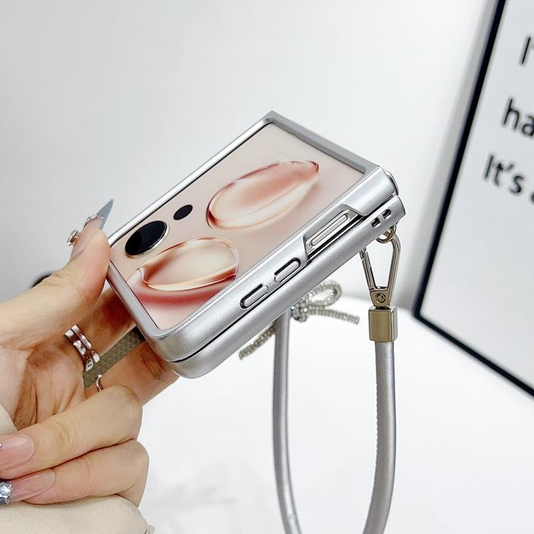 Silver phone case with textured front, side slots, and wrist strap with charm