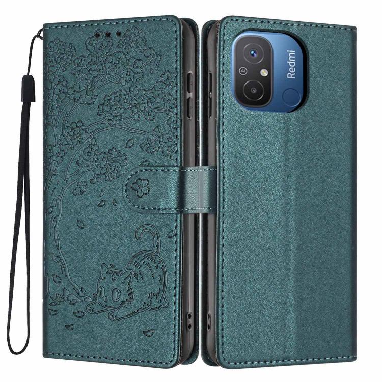Tree-cat embossed vegan leather flip phone case with wrist strap, teal green.