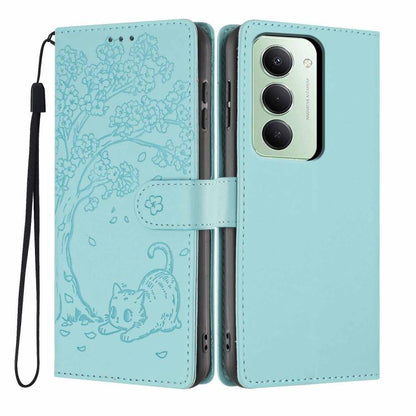Light sky blue embossed flip vegan leather phone case with cat tree design and wrist strap.
