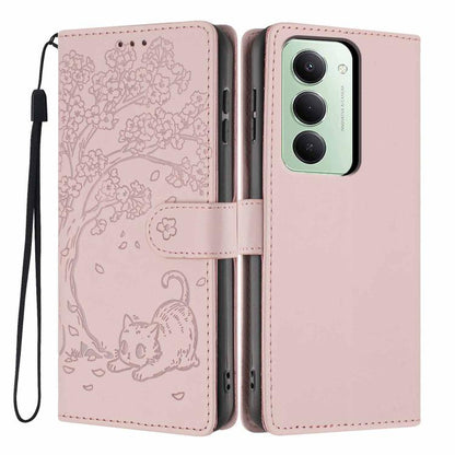 Light pink embossed flip vegan leather phone case with cat tree design and wrist strap.