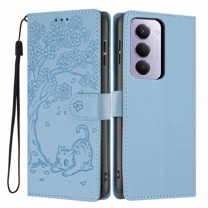 Light blue embossed flip vegan leather phone case with cat tree design and wrist strap.