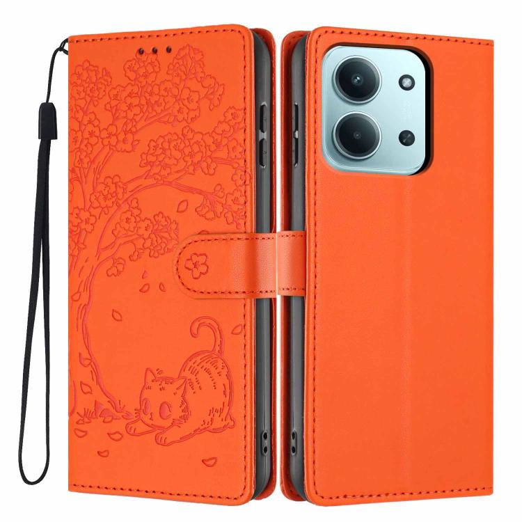 Orange vegan leather flip phone case with embossed tree cat design and wrist strap
