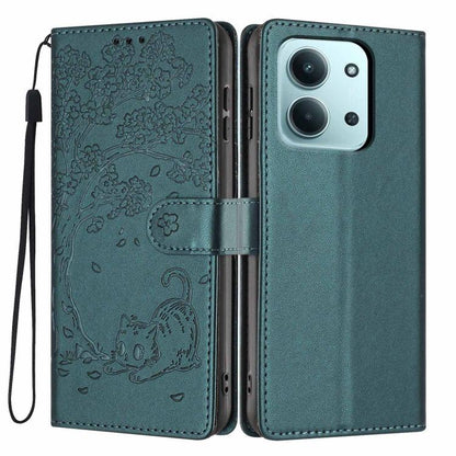 Teal embossed cat flip phone case with magnetic strap and wrist lanyard.