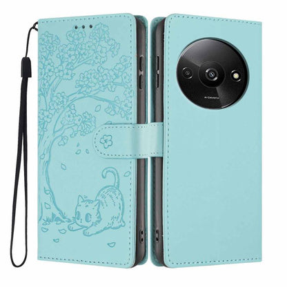 Aqua cat-embossed flip vegan leather phone case with wrist strap, front and back