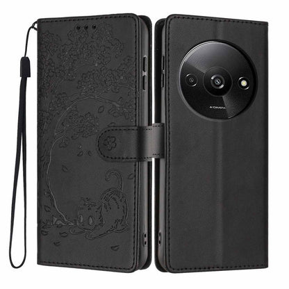 Black cat-embossed flip vegan leather phone case with wrist strap, front and back