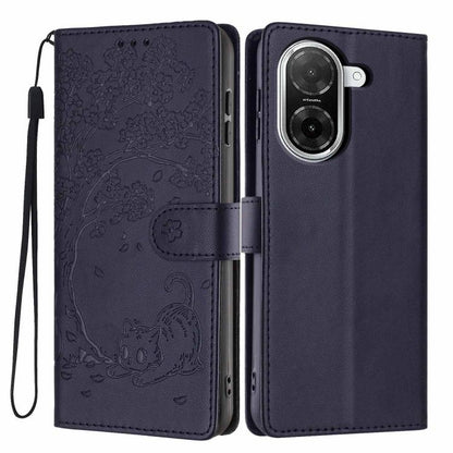 Deep navy flip phone case with embossed cat and tree scene, wrist strap, card holder panel.
