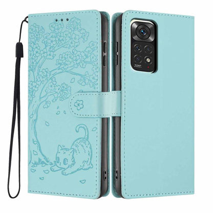 Light teal embossed cat tree flip vegan leather phone case with wrist strap