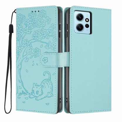 Tree cat embossed flip phone case in light blue, with wrist strap and camera cutout