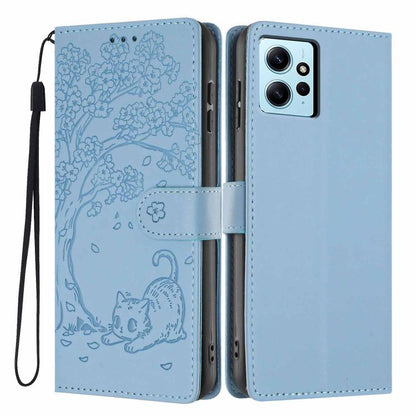 Tree cat embossed flip phone case in light blue, with wrist strap and camera cutout