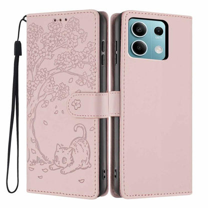 Rose pink flip vegan leather phone case with embossed tree cat and wrist strap.