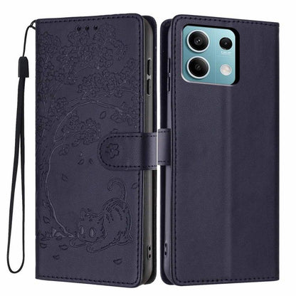Dark blue embossed flip vegan leather phone case with cat motif and wrist strap
