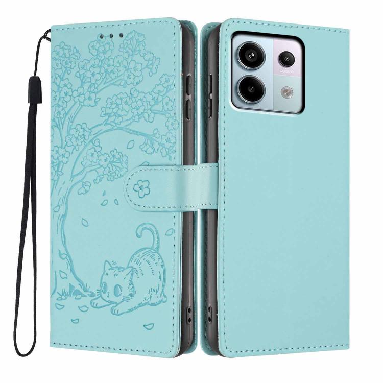 Embossed cat flip phone case in light green vegan leather, with wrist strap and slots