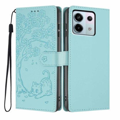Embossed cat flip phone case in light green vegan leather, with wrist strap and slots