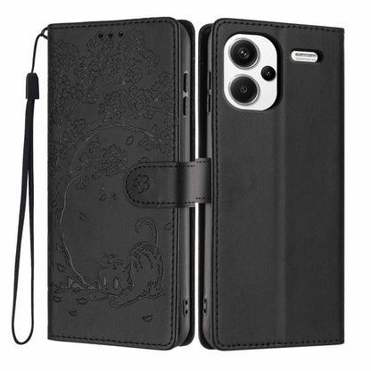 Black flip vegan leather phone case with embossed tree cat, wrist strap, camera cutout.