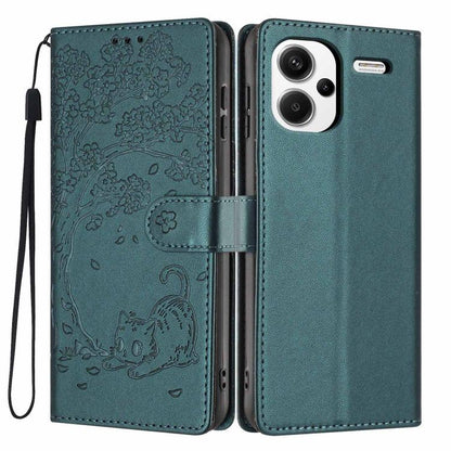 Embossed cat flip phone case in dark teal vegan leather, with wrist strap and slots
