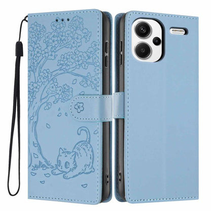 Embossed cat flip phone case in light blue vegan leather, with wrist strap and slots