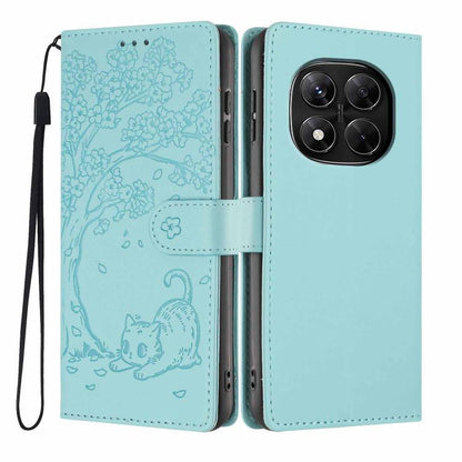 Aqua blue flip phone case with embossed cat and tree pattern, wrist strap included